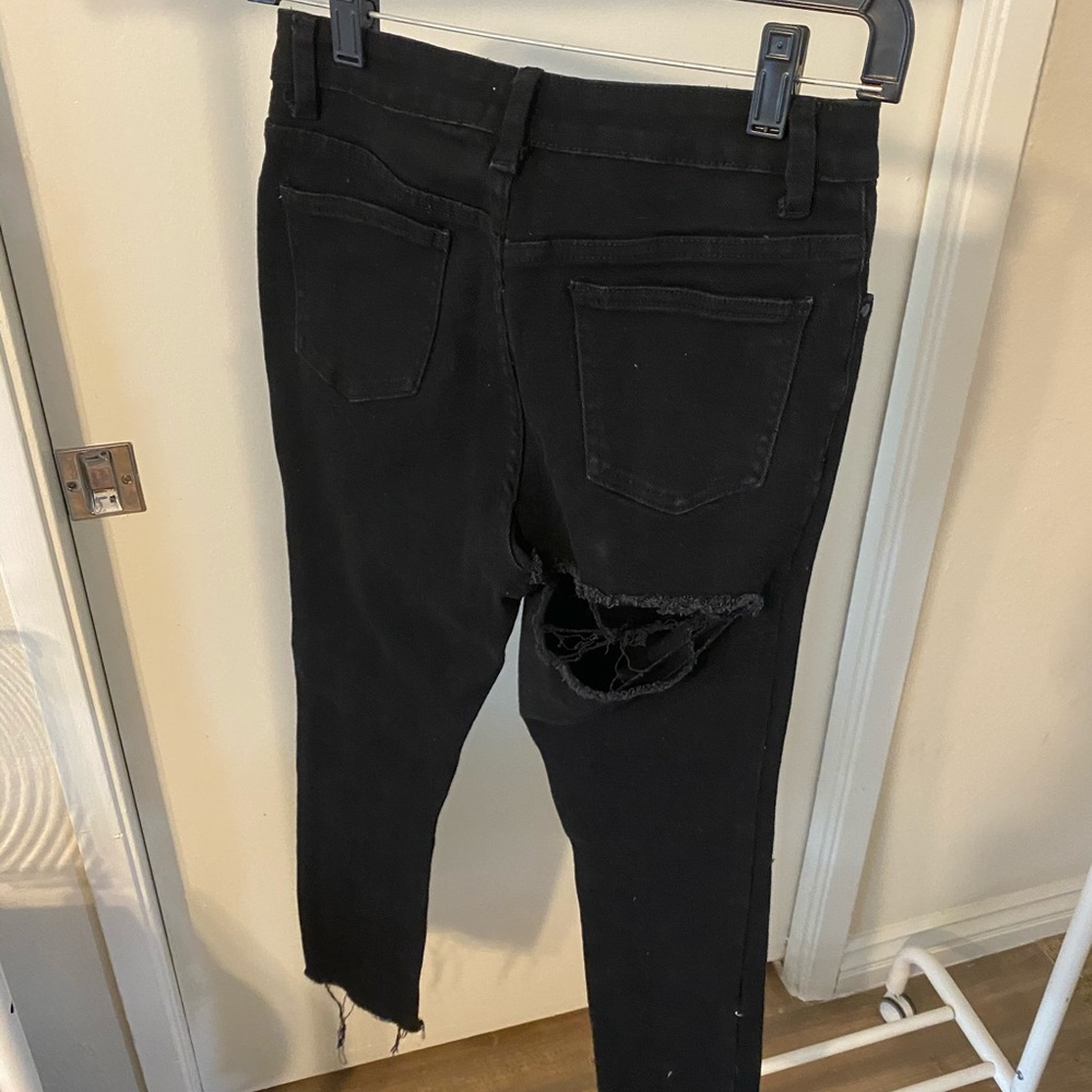 Black Jeans with bum rip